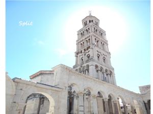 a church with a tower on top of it at Apartments Emi in Split