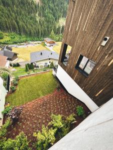 an aerial view of a yard next to a house at sGmiatli – Dein Hideaway Apartment in Kappl