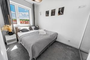 Posteľ alebo postele v izbe v ubytovaní Apartamenty Z Widokiem Na Mazury Jezioro Juno