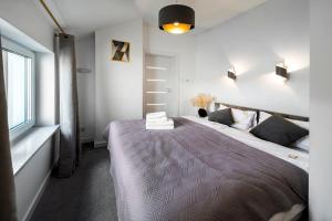 Posteľ alebo postele v izbe v ubytovaní Apartamenty Z Widokiem Na Mazury Jezioro Juno