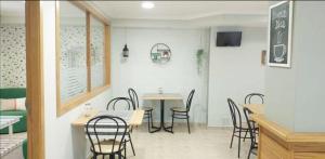 a dining room with a table and chairs at Habitaciones Ninfa in Villalonga +17 photos