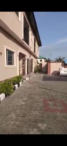 an empty street in front of a building at Luxury 2 bed apartment. 