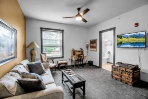 a living room with a couch and a table at Webber Hotel in Lyndonville