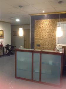 a reception counter in a room with a wall at Hostal Bisbal ONLY ADULTS NO AC in Valencia