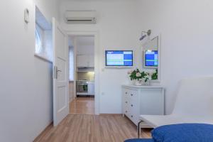Televízia a/alebo spoločenská miestnosť v ubytovaní Chic Apartment in Center