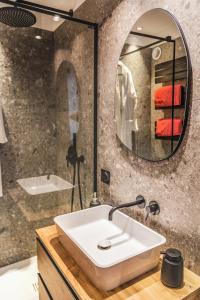 a bathroom with a sink and a mirror at Stylowa oaza w sercu miasta in Wrocław +11 photos