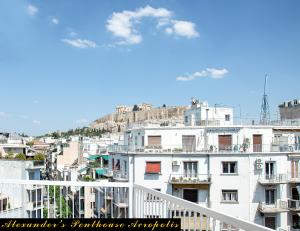 a view of a city from a balcony at Alexander's Penthouse in Athens
