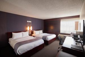 Ліжко або ліжка в номері Hotel Ruby Foo's