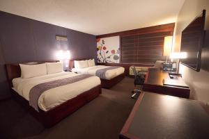 Ліжко або ліжка в номері Hotel Ruby Foo's