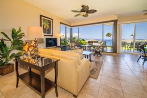 a living room with a couch and a table at Kapalua Villas Maui in Lahaina