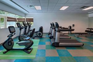 a gym with treadmills and elliptical machines at Element Houston Vintage Park in Houston