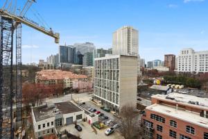 a view of a city with a crane and buildings at Piedmont Park 2 bdrm in Atlanta