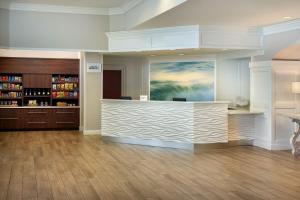 a lobby with a reception desk in a building at SpringHill Suites by Marriott Pensacola Beach in Pensacola Beach