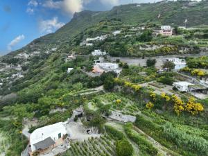 an aerial view of a village on a mountain at Appartamento di villa gesualda in Serrara Fontana