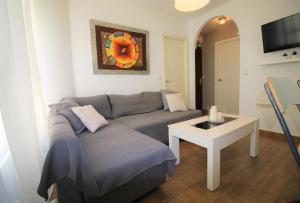 Televízia a/alebo spoločenská miestnosť v ubytovaní Descubre Málaga desde un Apartamento en su Centro Histórico