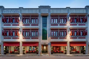 a facade of a building with red accents at The Vagabond Club A Tribute Portfolio Hotel Singapore in Singapore