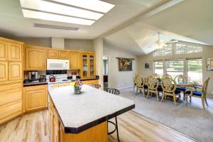 a kitchen and dining room with a table and chairs at Peaceful Hideaway about 16 Mi to Downtown Missoula! in Wye