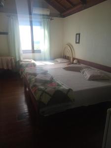 Łóżko lub łóżka w pokoju w obiekcie Pousada Capão do Índio