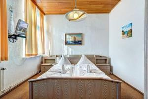 Ένα ή περισσότερα κρεβάτια σε δωμάτιο στο Pension Portofino