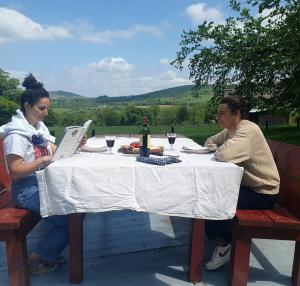 a man and a woman sitting at a table at The Safari Tent @ The Old Forge Glamping in Tullow