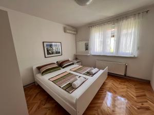 Postel nebo postele na pokoji v ubytování Guest House Kiwi Mostar