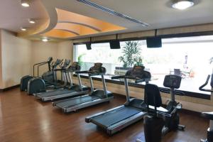 a gym with a row of treadmills at Hotel Plaza Juan Carlos in Tegucigalpa
