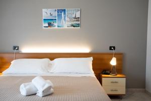 Ліжко або ліжка в номері Hotel D'Atri