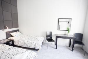 Łóżko lub łóżka w pokoju w obiekcie Rent-Apart City Center Lodz