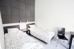 Łóżko lub łóżka w pokoju w obiekcie Rent-Apart City Center Lodz