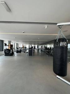 a gym with a large black bag hanging from the ceiling at Exclusivo departamento en cdmx in Mexico City