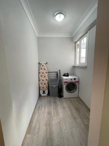 a laundry room with a washing machine and a washer at The VIP Guest - Luxury Home in Nisantasi in Istanbul