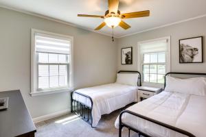 a bedroom with two beds and a ceiling fan at Milwaukee Home with Serene Patio and Backyard Garden! in Milwaukee