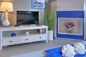 TV a/nebo společenská místnost v ubytování L'air Du temps Resort