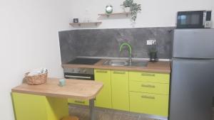 a kitchen with a sink and a refrigerator at In the nature by Marko in Benkovac