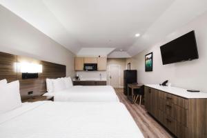 TV o dispositivi per l'intrattenimento presso SureStay Studio by Best Western Conroe Downtown