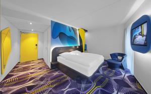Ένα ή περισσότερα κρεβάτια σε δωμάτιο στο prizeotel Erfurt-City