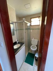 a small bathroom with a toilet and a sink at flat serra negra - bezerros - PE flat 007 - 009 in Bezerros