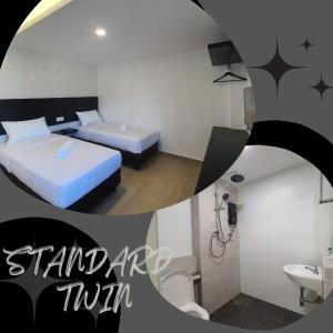 a room with two beds and a bathroom with a sink at E Hotel in Kulim