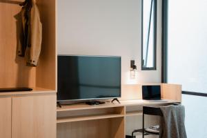 a television sitting on a desk in a room at Casa Lomah WTC in Mexico City