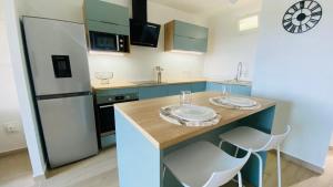 Kuchyň nebo kuchyňský kout v ubytování Appartement Océan View