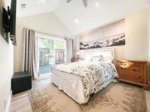a bedroom with a bed and a large window at ~SJ Glass Sanctuary W/ Firepit/Cafe/Office/BBQ~ in San Jose