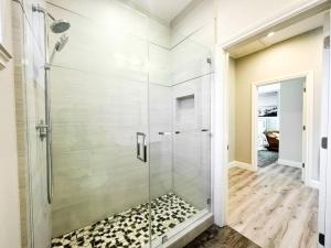 a bathroom with a shower with a glass door at ~SJ Glass Sanctuary W/ Firepit/Cafe/Office/BBQ~ in San Jose