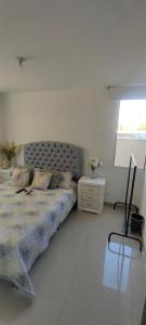Postel nebo postele na pokoji v ubytování Confortable apartmento en Ricaurte cundinamarca