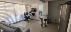 TV a/nebo společenská místnost v ubytování Confortable apartmento en Ricaurte cundinamarca