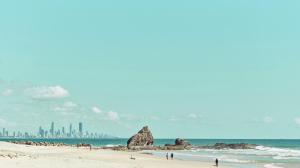 a view of a beach with a city in the background at Houston Beachfront Apartments in Gold Coast