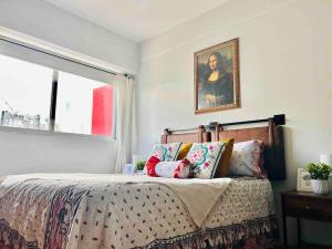 Postel nebo postele na pokoji v ubytování Lindo Depa muy cerca de Coyoacan y Universidad