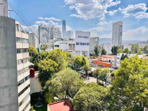 Nespecifikovaný výhled na destinaci Mexiko nebo výhled na město při pohledu z apartmánu