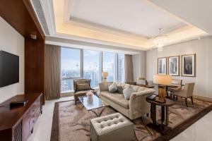 a living room with a couch and a table at The St. Regis Chengdu in Chengdu