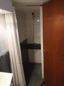 a bathroom with a shower with a glass door at Espacio km3 in Comodoro Rivadavia
