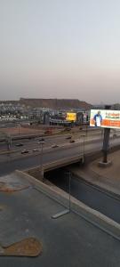 a billboard on the side of a highway at The Panoramic View - Luxury Apartments in Cairo in Cairo